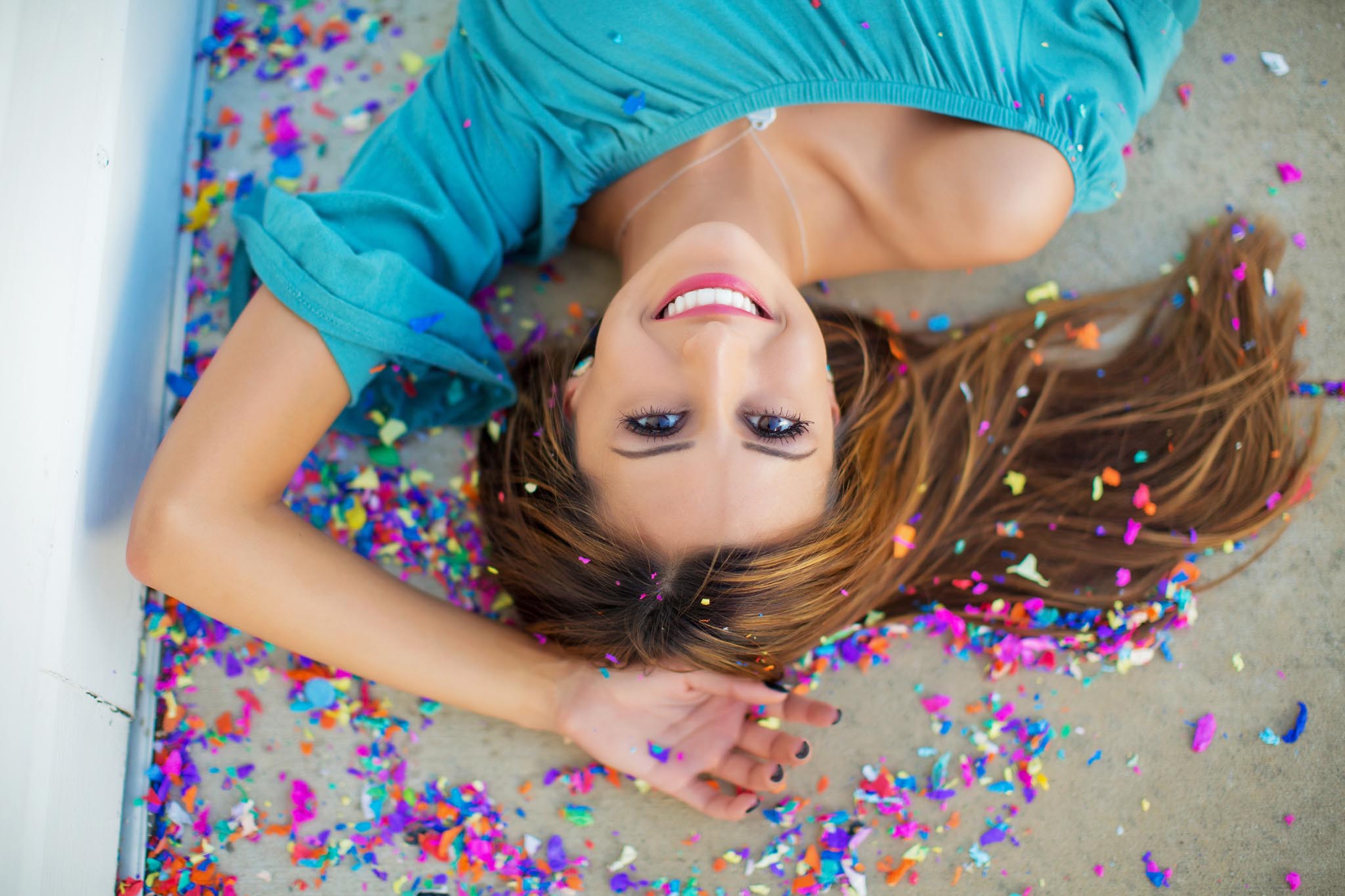Close up of girl surrounded by confetti
